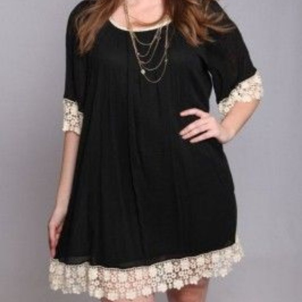 Black flowy dress with white lace